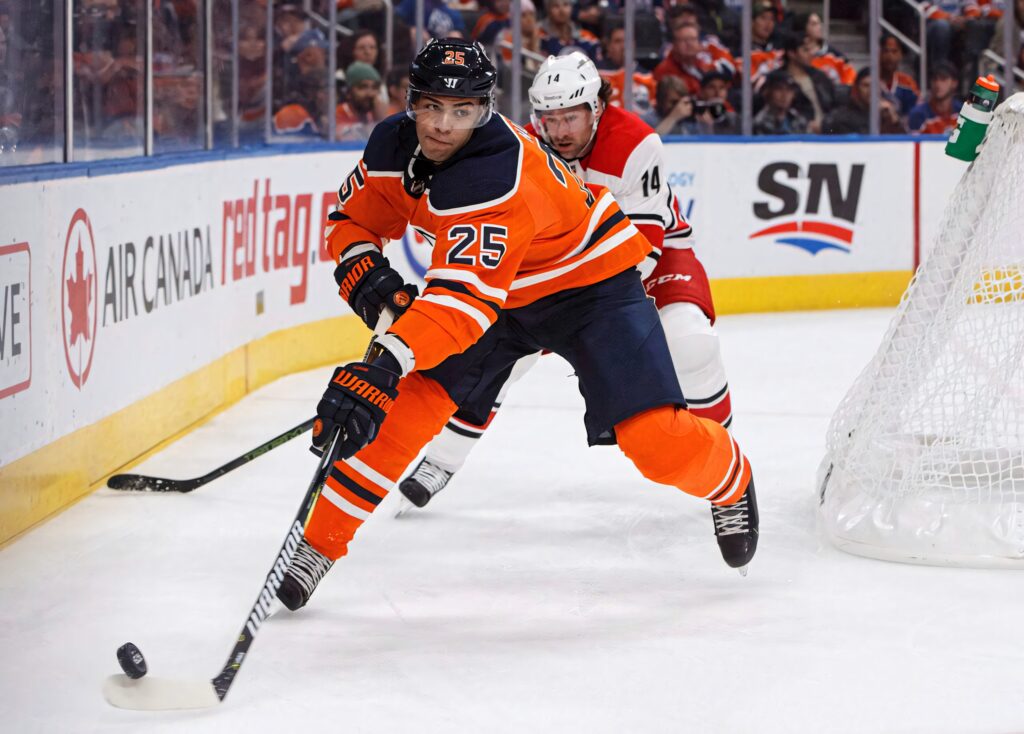 Darnell Nurse Edmonton Oilers controls puck against Philadelphia Flyers 2019 intense hockey play Wallpaper