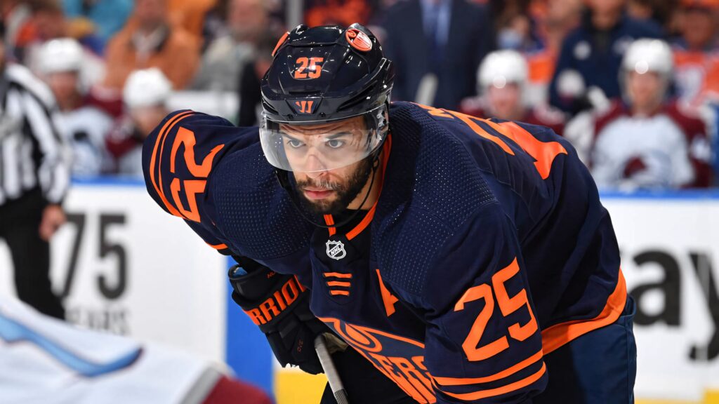 Darnell Nurse Edmonton Oilers intense focus 2022 game vs Vancouver Canucks navy orange uniform Wallpaper