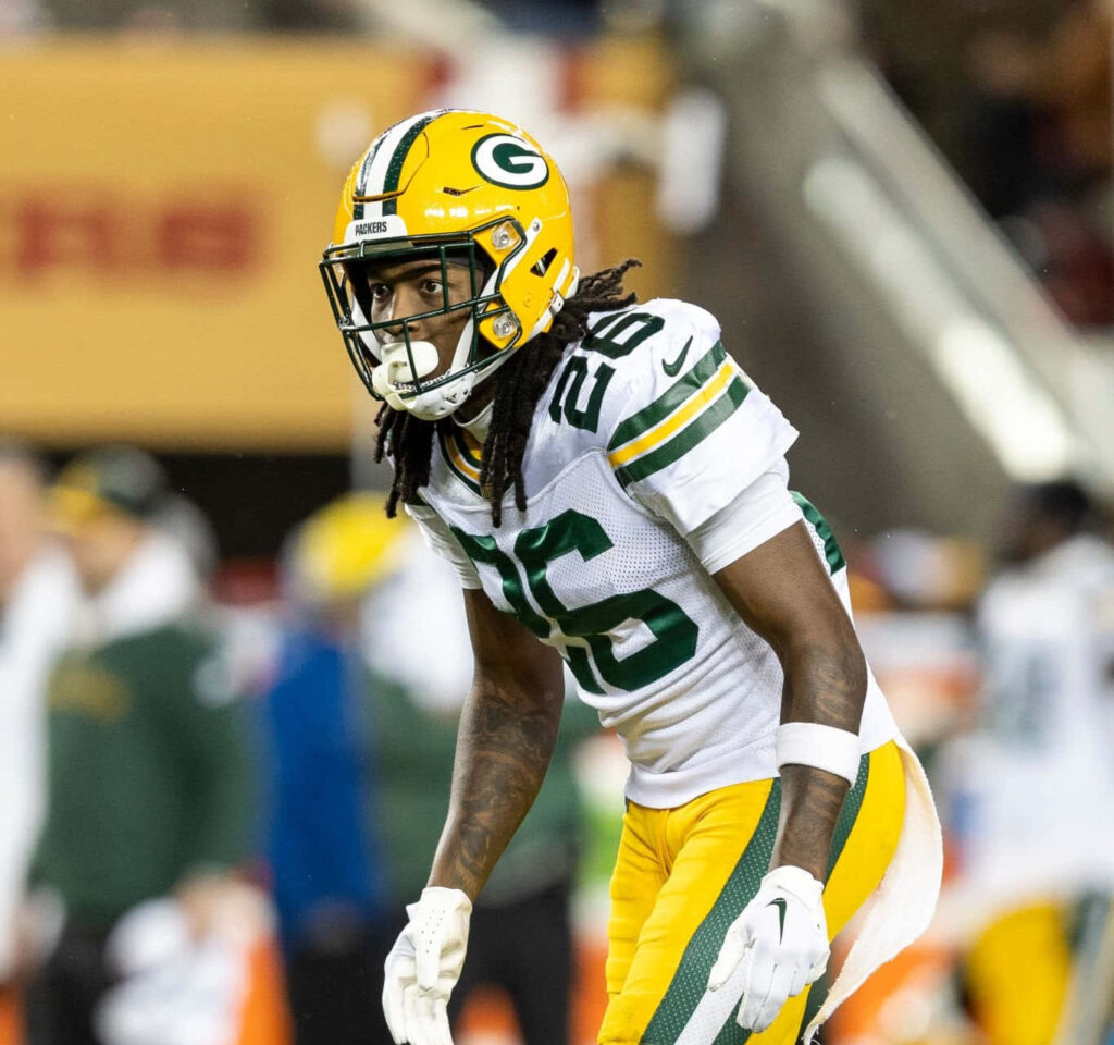 Darnell Savage Jr Green Bay Packers in action showing focus and athleticism on football field Wallpaper