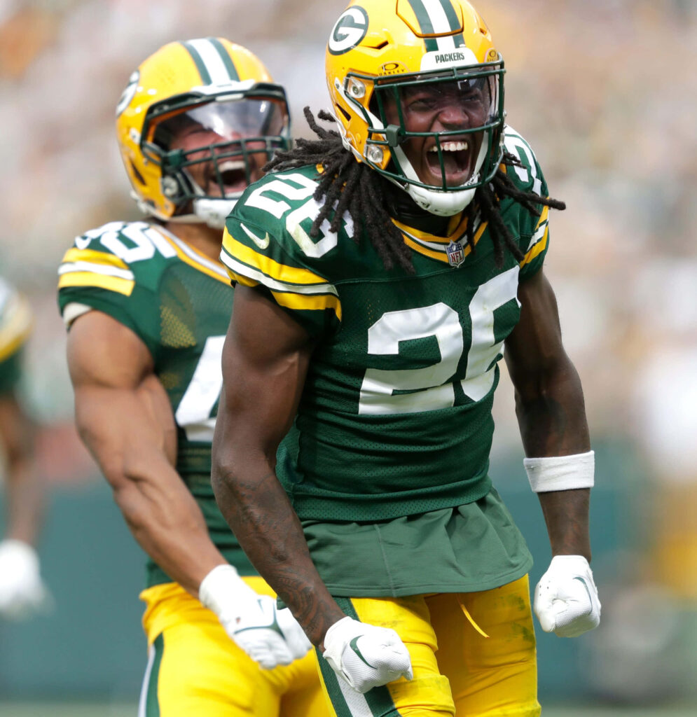 Darnell Savage Jr Green Bay Packers celebrating on field wearing vibrant team colors game day energy Wallpaper