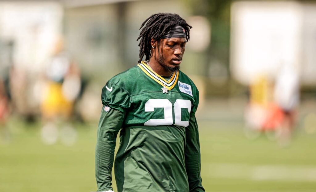 Darnell Savage Jr in Green Bay Packers green jersey number 26 practicing on football field wallpaper