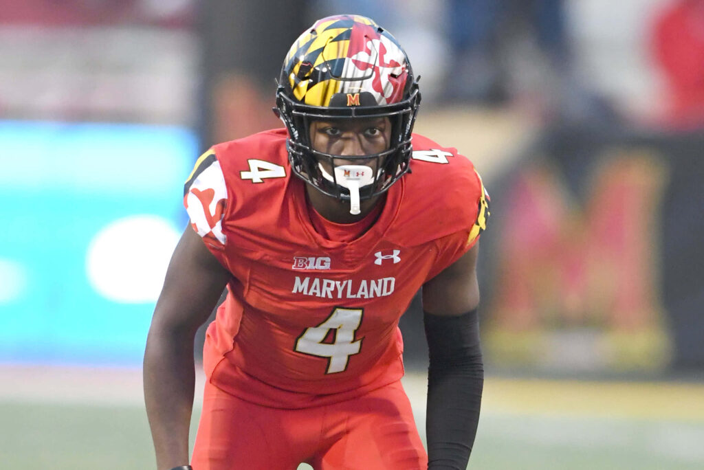 Darnell Savage Jr. in red Maryland uniform with helmet ready for game on stadium background wallpaper