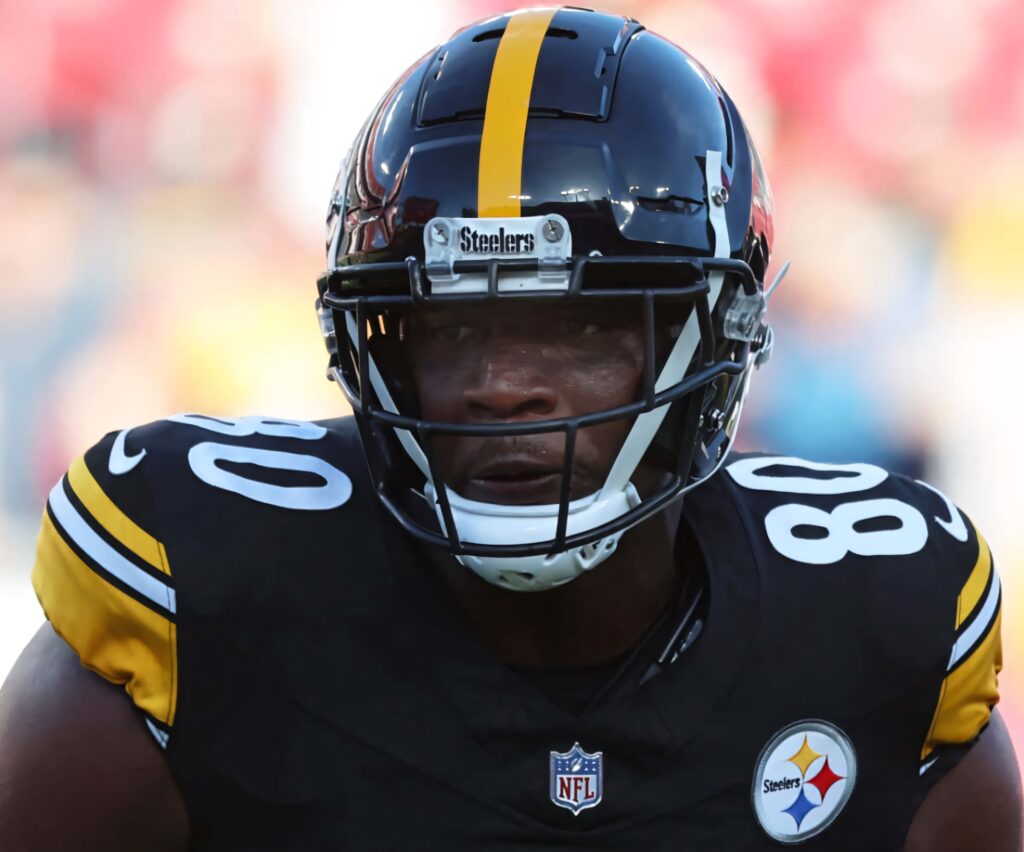 Darnell Washington in Pittsburgh Steelers uniform showing intensity under bright stadium lights Wallpaper