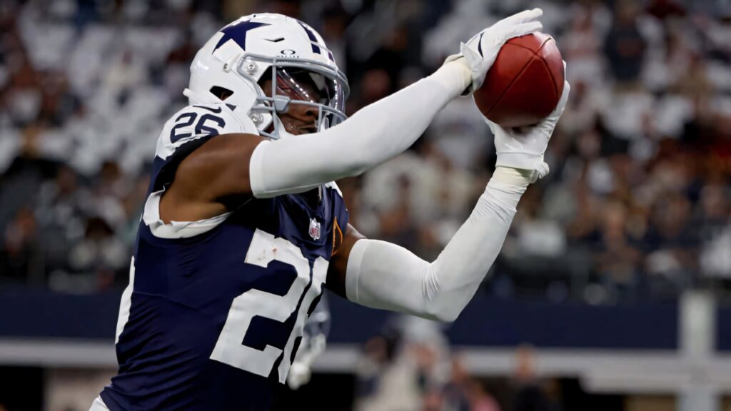 Daron Bland Dallas Cowboys catching football in navy white uniform intense game action wallpaper