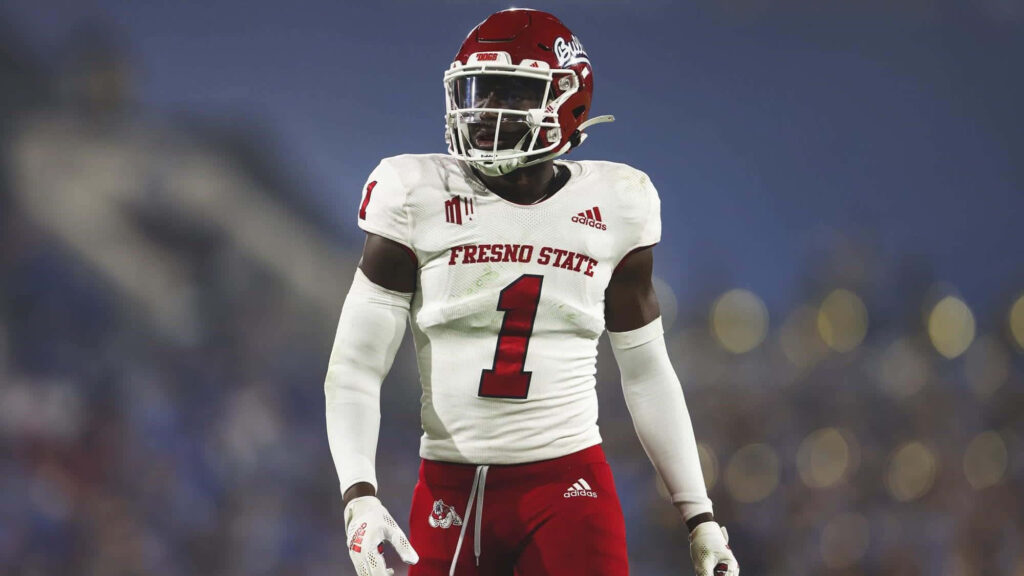 Daron Bland in Fresno State number 1 football jersey with stadium backdrop showing determination Wallpaper