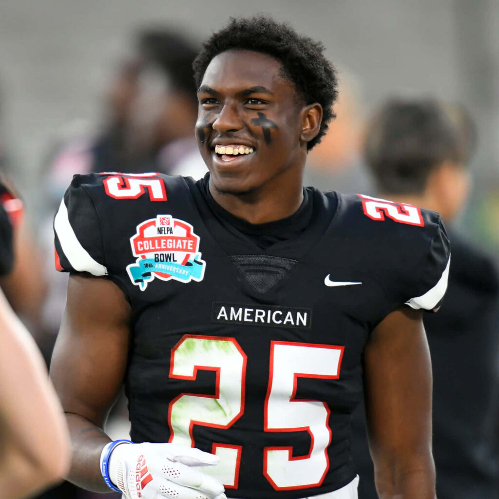 Daron Bland football wallpaper smiling in number 25 jersey bold black red white colors energizing