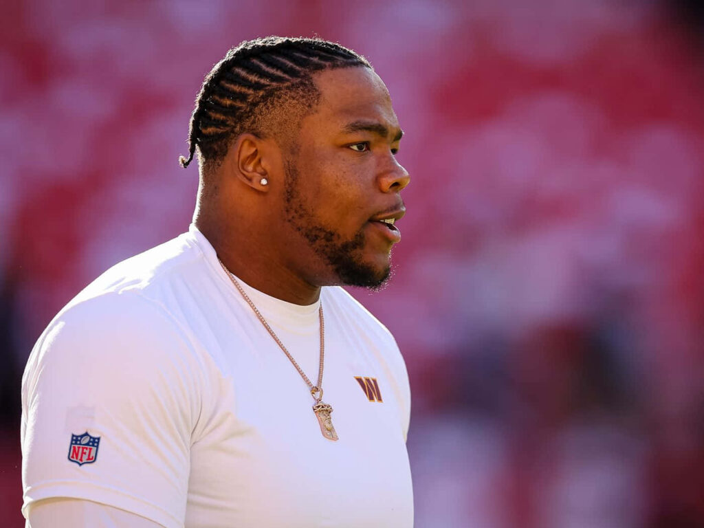 Daron Payne NFL player profile with braided hair athletic build stadium background wallpaper