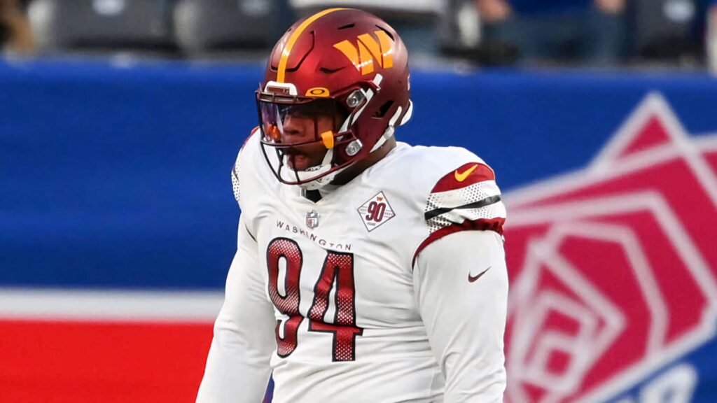 Daron Payne number 94 in Washington Football Team uniform ready for NFL action on field Wallpaper