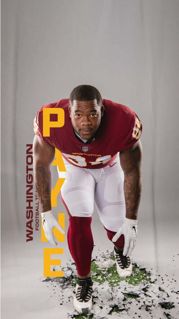 Daron Payne Washington Football Team action pose burgundy gold uniform cracked turf wallpaper