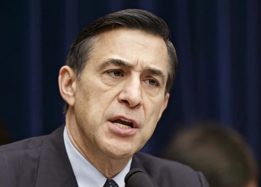 Darrell Issa speaking passionately in formal attire with dark blurred background political wallpaper