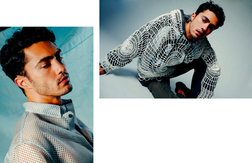 Darren Barnet in Dior modern fashion wallpaper with intricate mesh knit textures and soft lighting