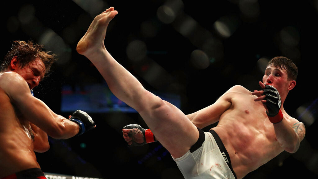 Darren Till powerful high kick MMA fight athleticism determination octagon action wallpaper