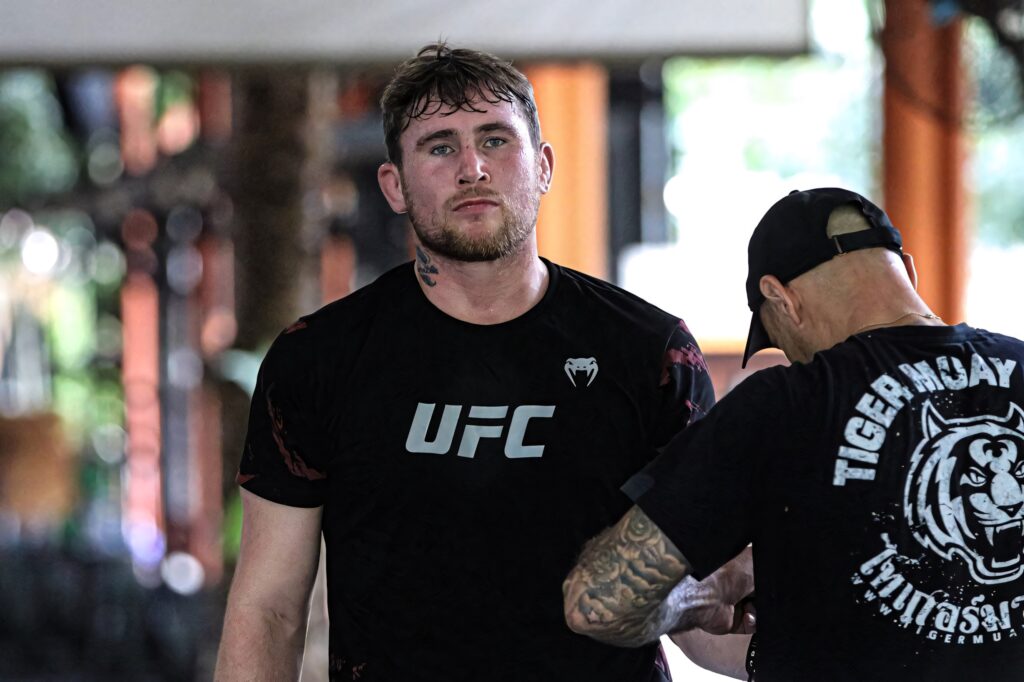 Darren Till focused in black UFC shirt gym background intense determined training wallpaper