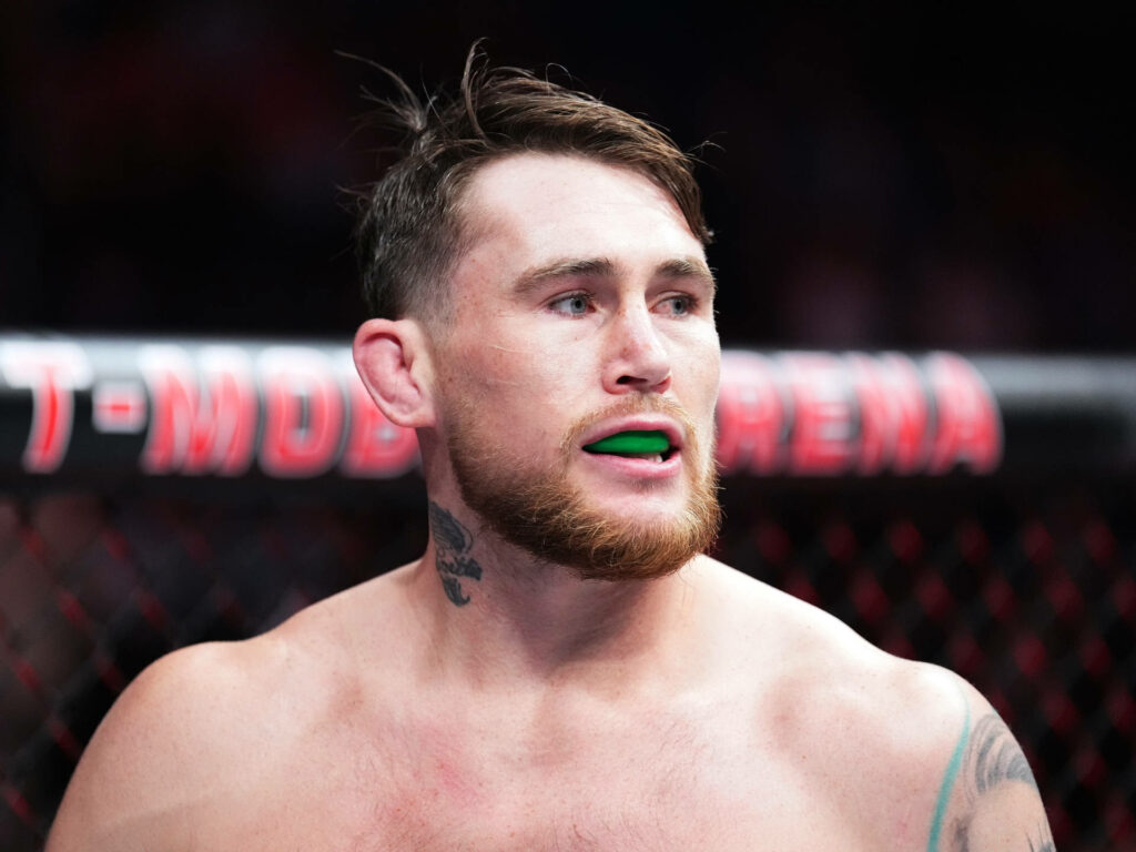 Darren Till in octagon with green mouthguard intense MMA fight focused athlete wallpaper background