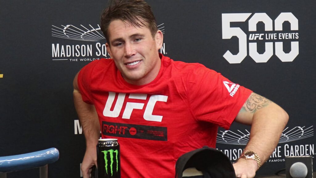 Darren Till at UFC press conference wearing red UFC shirt with UFC 500 Live Events backdrop Wallpaper