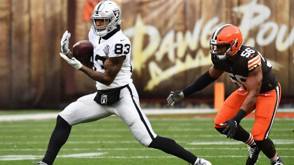 Darren Waller catching pass versus Malcolm Smith Browns in dynamic NFL stadium action wallpaper