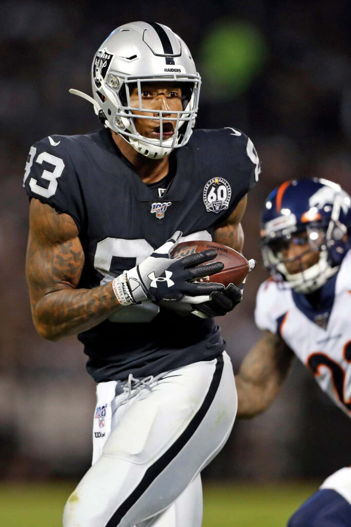 Darren Waller Raiders uniform football action intense focus stadium background wallpaper