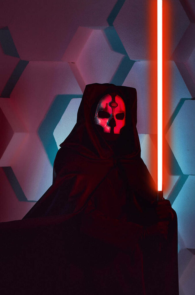 Darth Nihilus portrait with glowing red lightsaber on textured sci-fi hexagonal background wallpaper