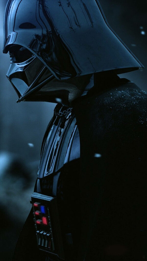 Darth Vader in black armor and helmet standing ominously in shadowed atmospheric wallpaper