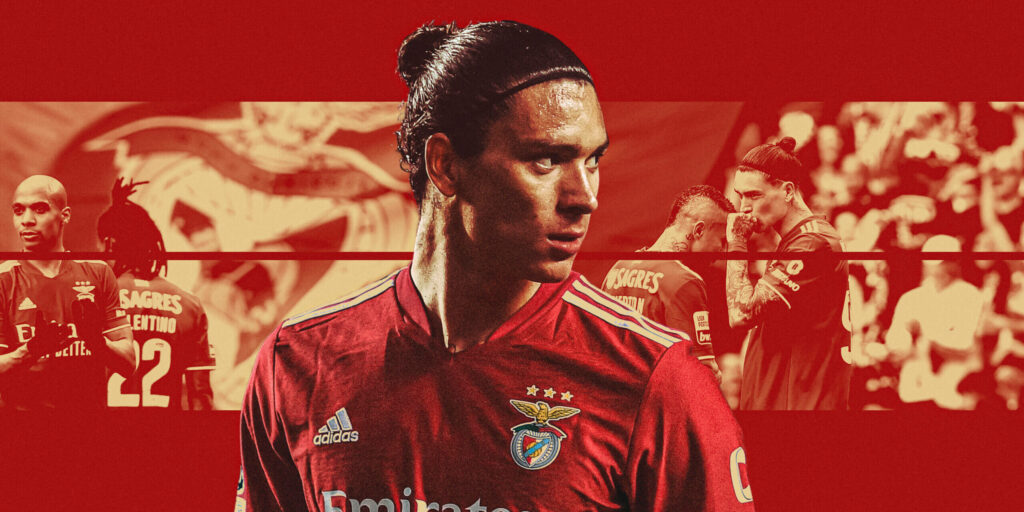 Darwin Núñez Benfica wallpaper red background dynamic action shots and club emblem behind him