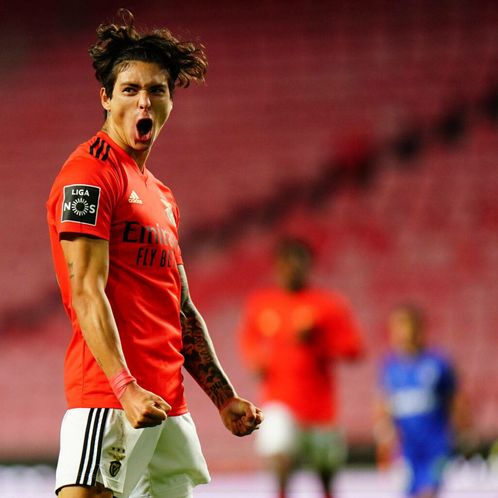 Darwin Núñez celebrating passionately in Benfica red kit on vibrant stadium football field background Wallpaper