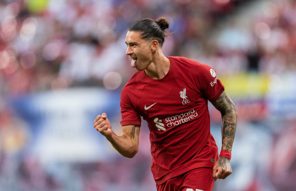 Darwin Núñez in Liverpool red kit celebrates passionately with clenched fist and tongue out Wallpaper
