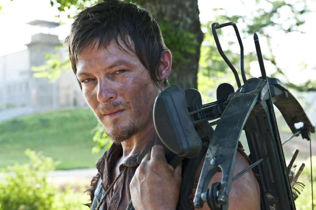 Daryl Dixon Wallpaper: Iconic Crossbow & Rugged Look in Forest
