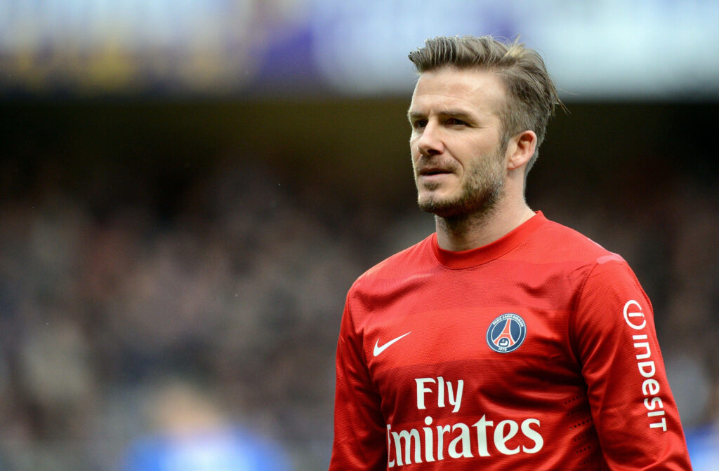 David Beckham in Red PSG Jersey: Iconic Style Wallpaper Background