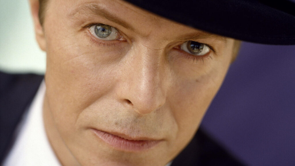 Close-up portrait of David Bowie Nothing Has Changed album intense gaze signature style wallpaper