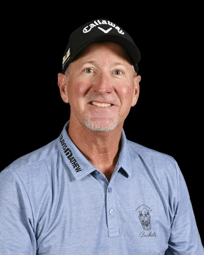 David Duval golf portrait in light blue polo and black Callaway cap on black background wallpaper