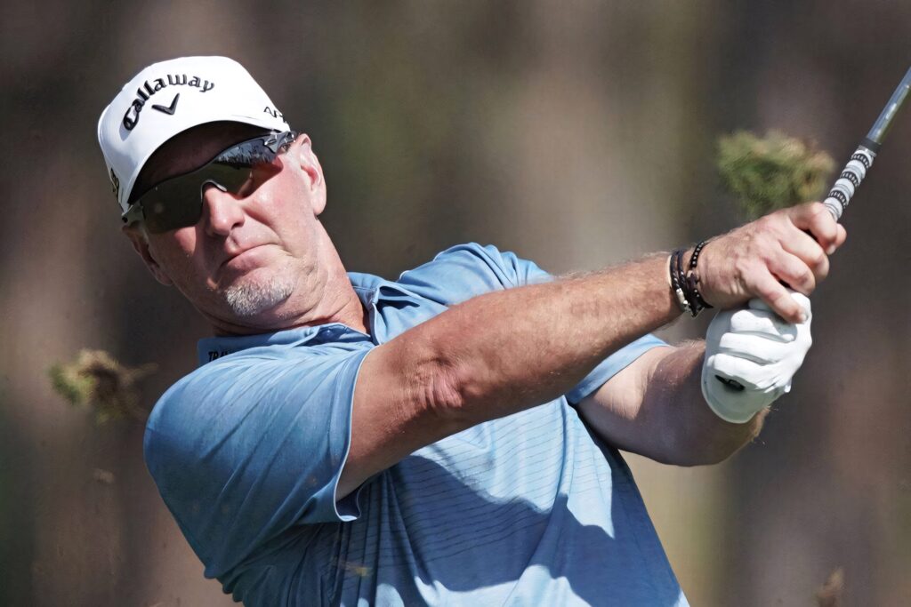 David Duval mid-swing golf wallpaper wearing Callaway cap classic sunglasses blue polo sunlight