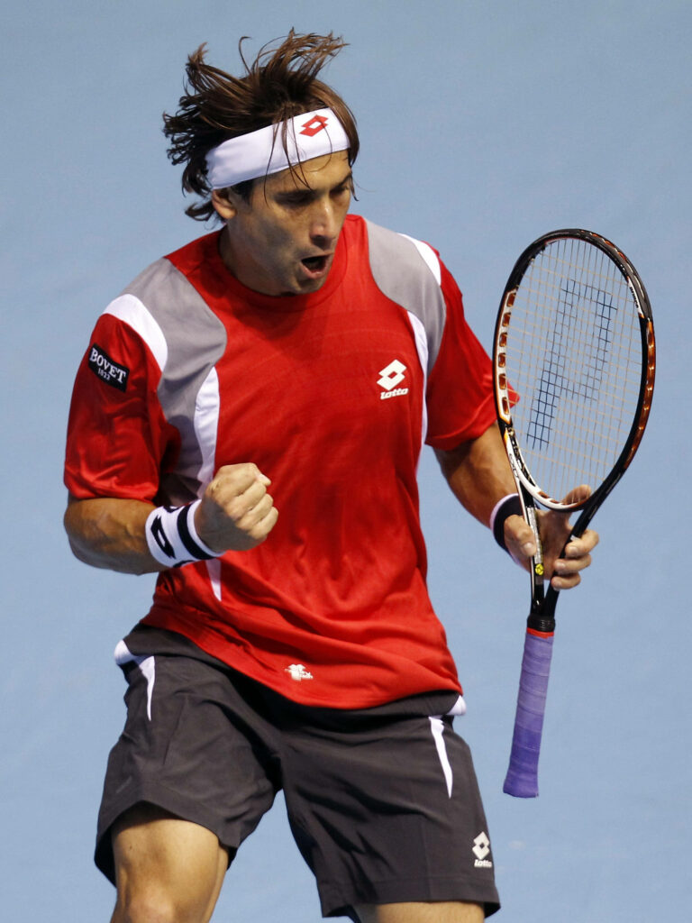 David Ferrer tennis player fist pump intense focus red black sportswear blue background wallpaper