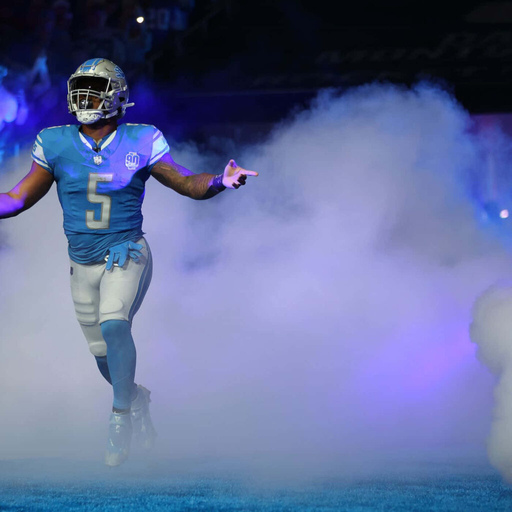 David Montgomery football entrance through smoke blue silver uniform intense game day wallpaper