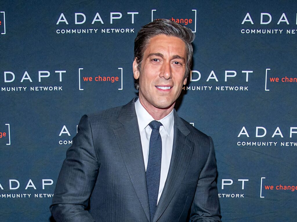 David Muir in sharp grey suit at 2019 Adapt Leadership Awards blue backdrop formal event Wallpaper