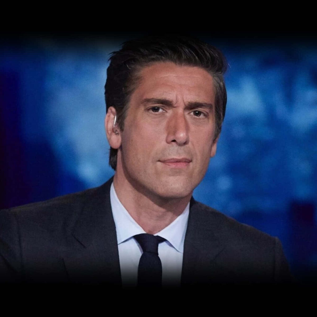 David Muir sharp headshot with blue blurred background dark suit professional serious expression Wallpaper