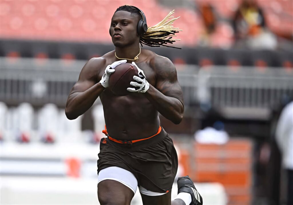 David Njoku running in football training intense athletic energy vibrant field sports gear wallpaper