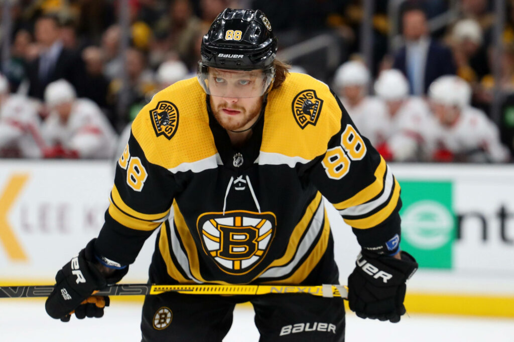 David Pastrnak Boston Bruins number 88 focused on ice during NHL game against Dallas Stars wallpaper