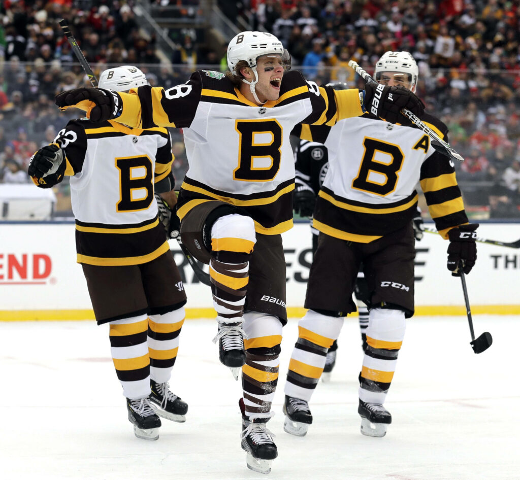 David Pastrnak scores celebrating in Boston Bruins throwback jersey NHL Winter Classic outdoor game Wallpaper