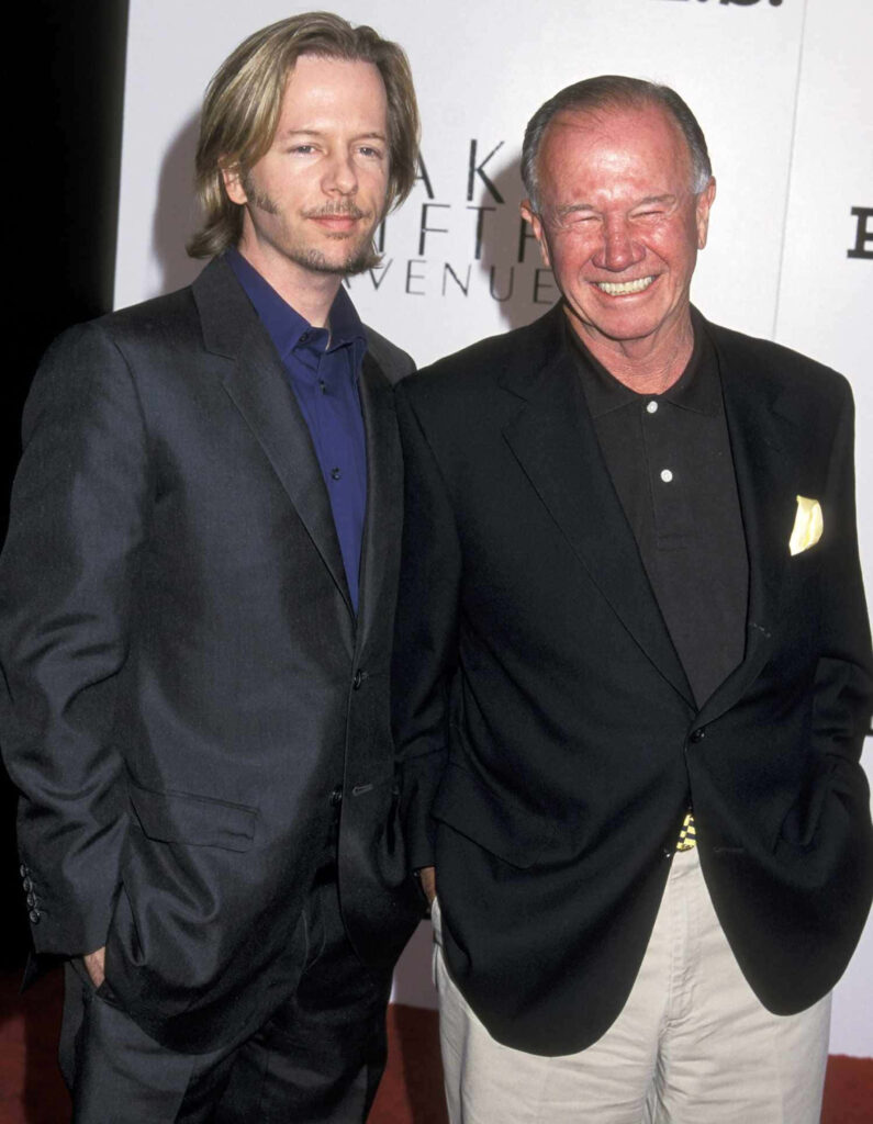David Spade and father Wayne Spade in dark suits on red carpet smiling for family portrait wallpaper