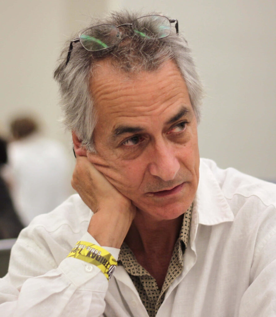 David Strathairn casual white shirt glasses thoughtful expression soft lighting wallpaper background
