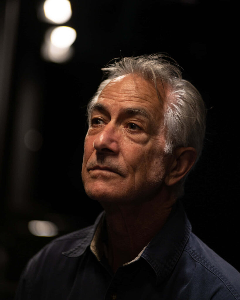 David Strathairn cinematic portrait with dramatic lighting and thoughtful expression wallpaper background