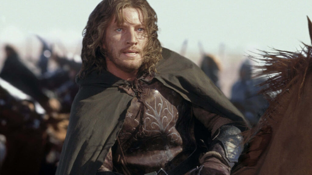 David Wenham in detailed medieval armor riding horse in epic fantasy battle scene wallpaper