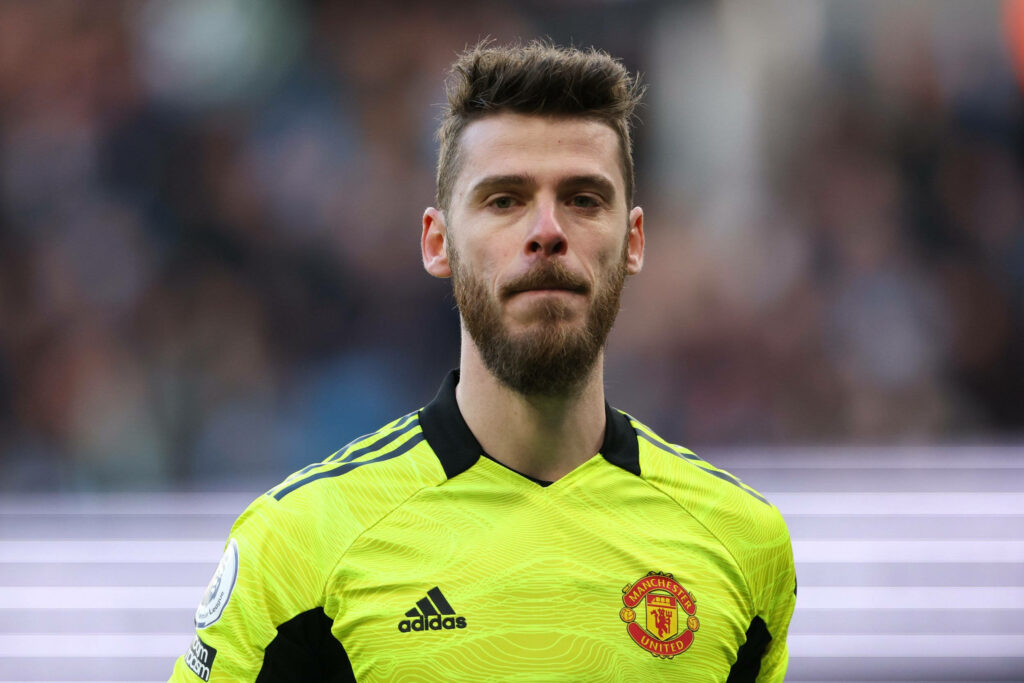 Close-up of David de Gea in neon yellow Manchester United goalkeeper jersey with focused expression Wallpaper