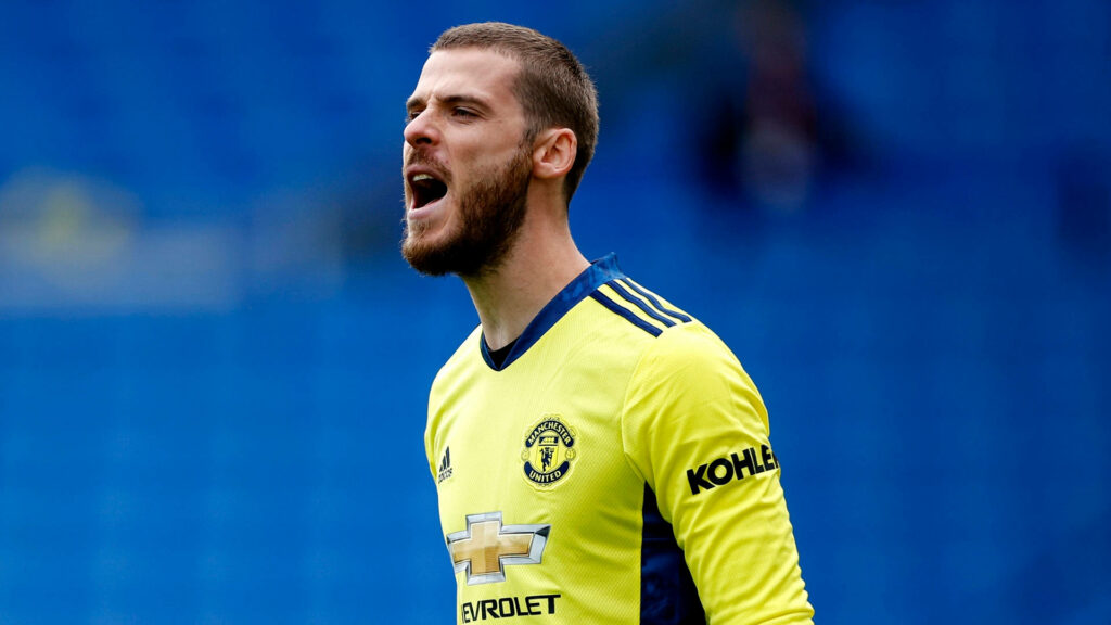 David de Gea shouting in yellow Manchester United kit with vibrant blue intense background wallpaper