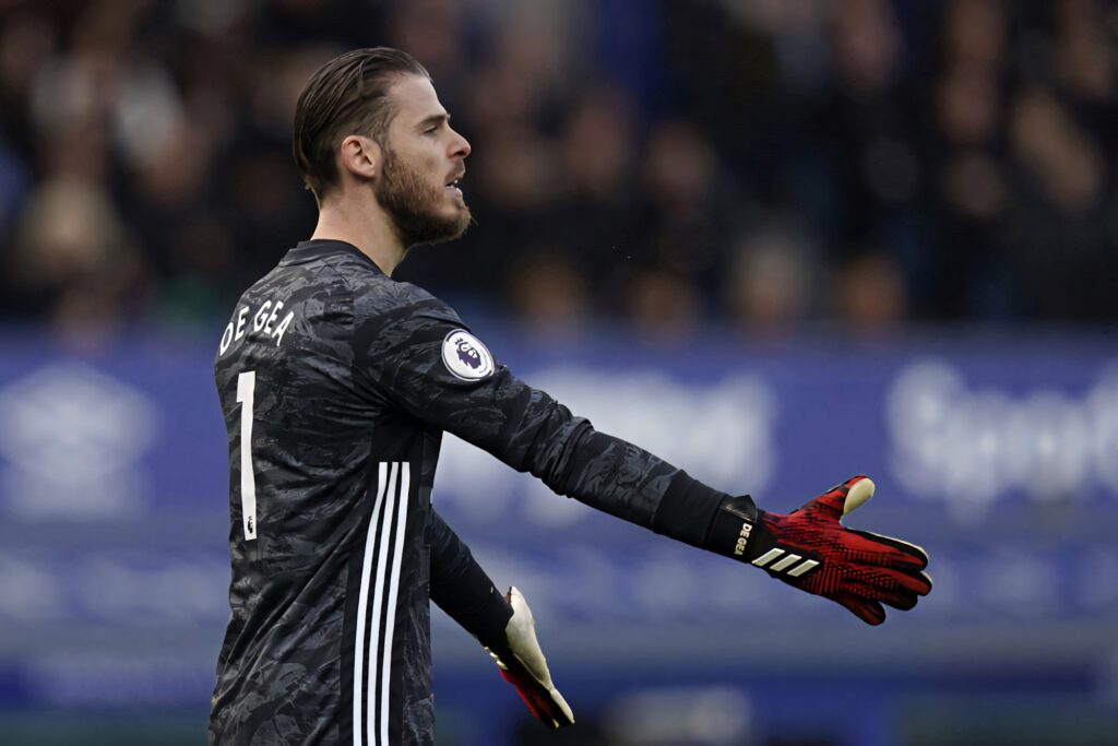 David de Gea Manchester United goalkeeper in dark kit with red gloves prepares to save shot Wallpaper