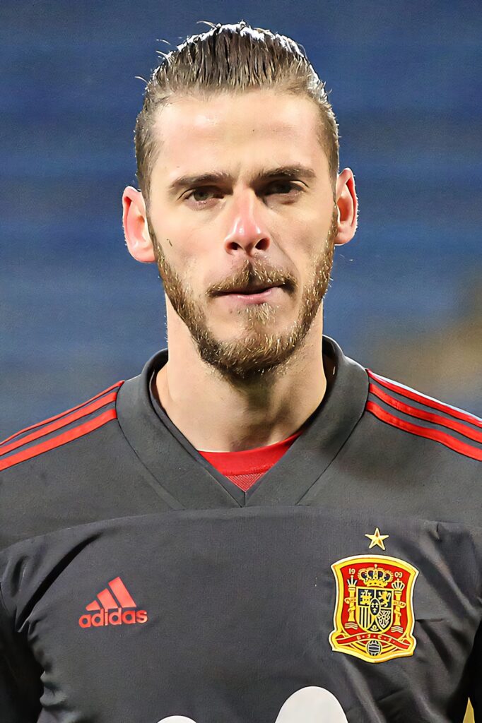 David de Gea in black Adidas Spain goalkeeper kit with red accents focused professional look wallpaper
