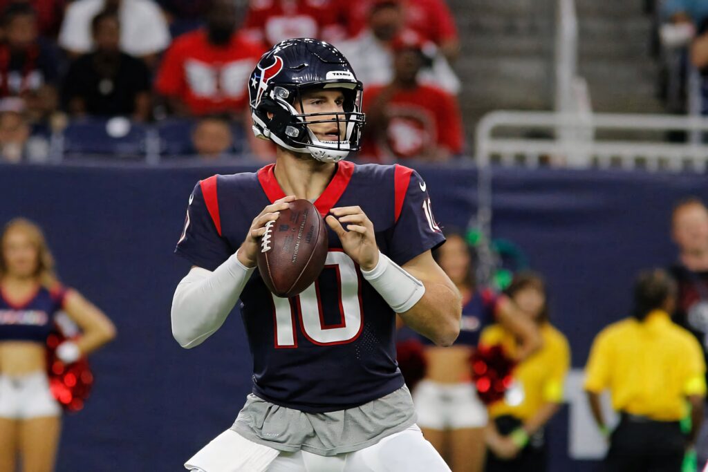 Davis Mills Houston Texans quarterback preparing to throw football vivid stadium wallpaper background