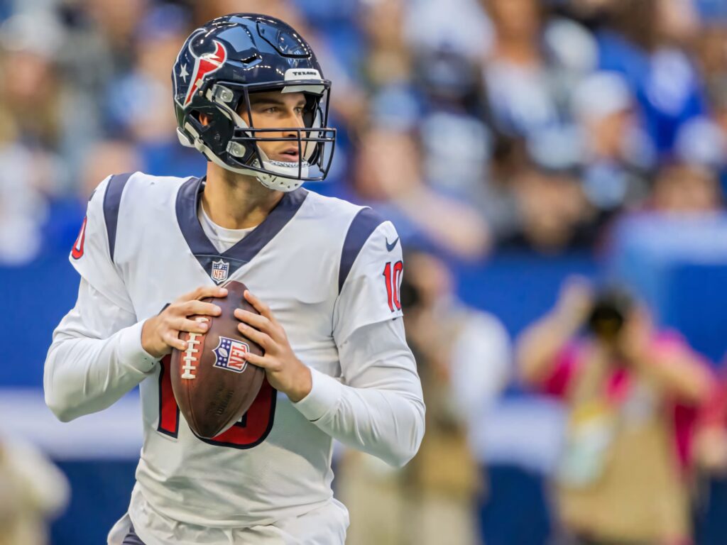 Davis Mills Houston Texans football quarterback throwing pass in stadium action wallpaper