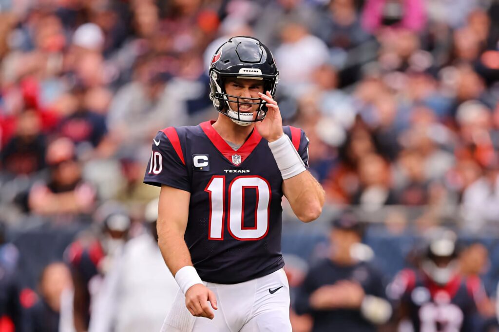 Davis Mills Houston Texans uniform ready to play vibrant NFL stadium game day energy wallpaper
