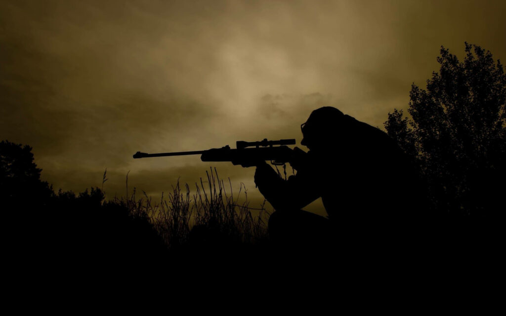 Dawn Stalkers: A Hunter's Silent Pursuit Wallpaper
